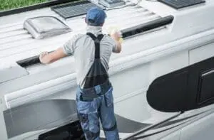 How to Winterize your RV(https://www.timminsrv.com/how-to-winterize-your-rv-2/) – Rv service worker cleaning camper van roof 8QZ86NF 300x197 jpeg